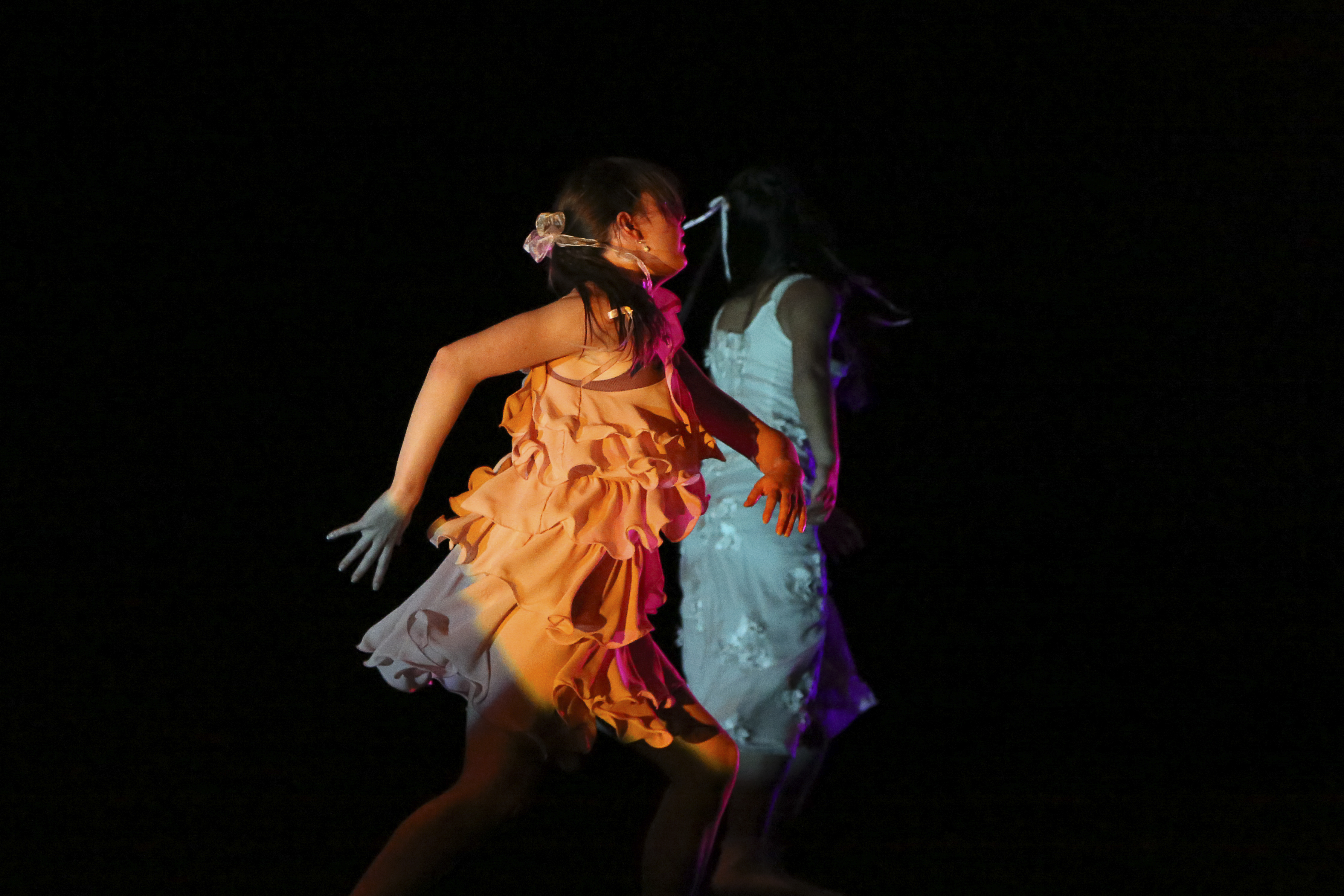 Two dancers in peach and white